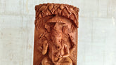 Intricate Cylindrical Wooden Carving with Ganesha and Sacred Cow Scenes